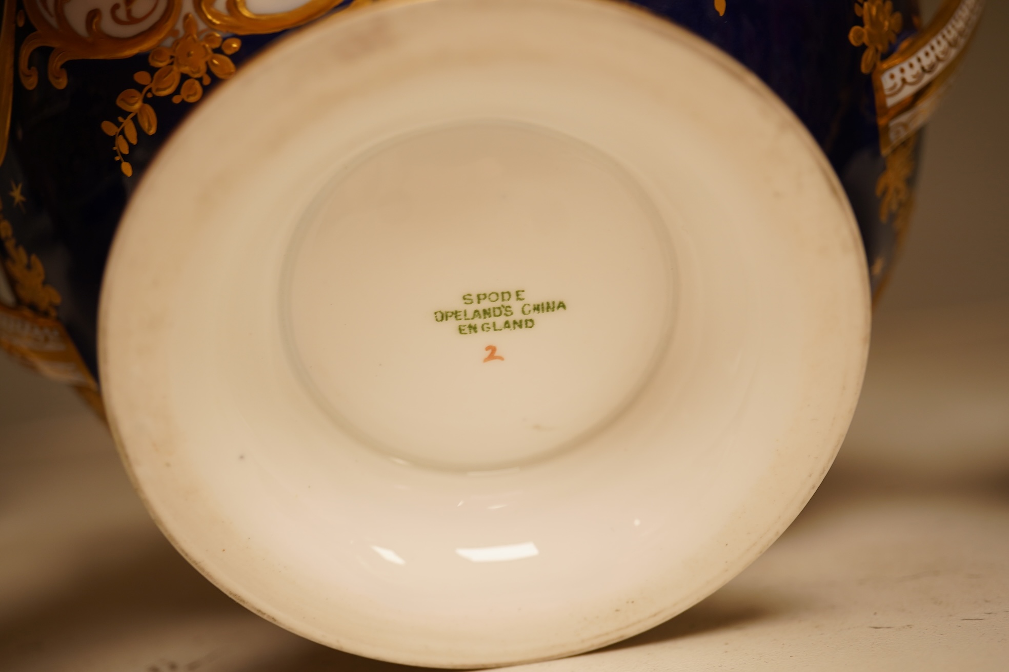 A collection of Royal Crown Derby, to include a two handled bowl, a fluted pedestal vase, saucer with landscape central cartouche etc (5). Vase 19cm high.